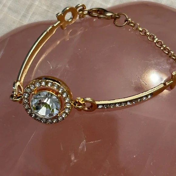 Gold and cubic zirconia focal stone with smaller cz’s each side. - Picture 7 of 9